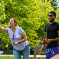 Mom & student playing cornhole